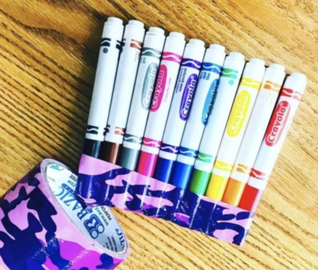 Crayola markers with their lids duct taped together