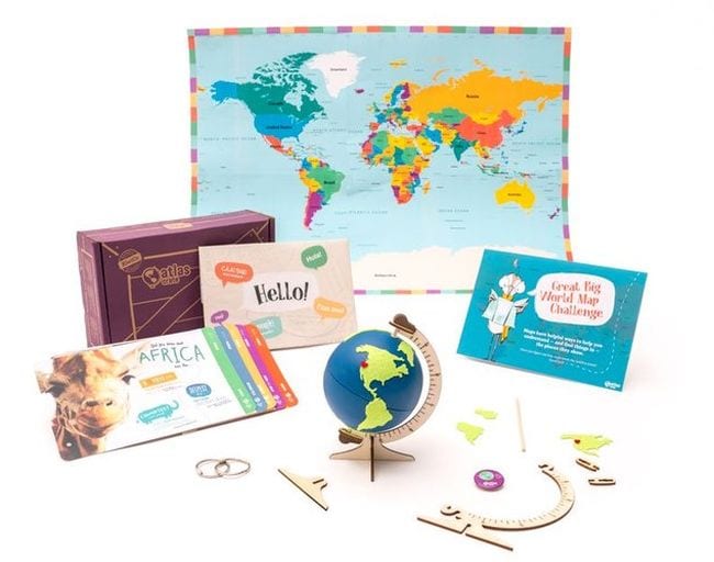 Array of geography learning items including a small globe from KiwiCo Atlas Crates educational subscription boxes