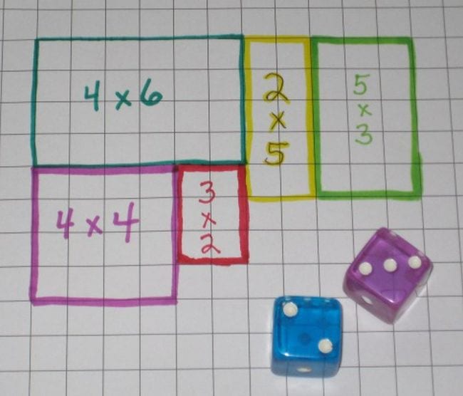 Rectangles of different sizes and colors drawn and labeled on graph paper, next to a pair of dice