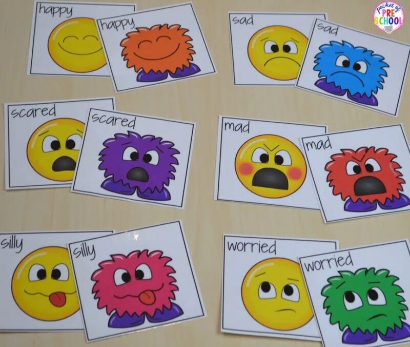 Colorful monster emotion cards spread out on a table