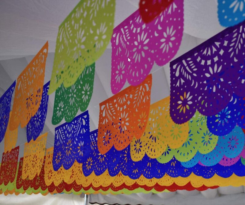 Colorful Papel Picado handing from the ceiling for hispanic heritage month