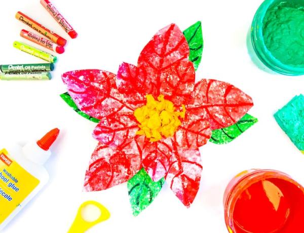 Colorful poinsettia created with pastels, glue and scissors for a hispanic heritage month activity