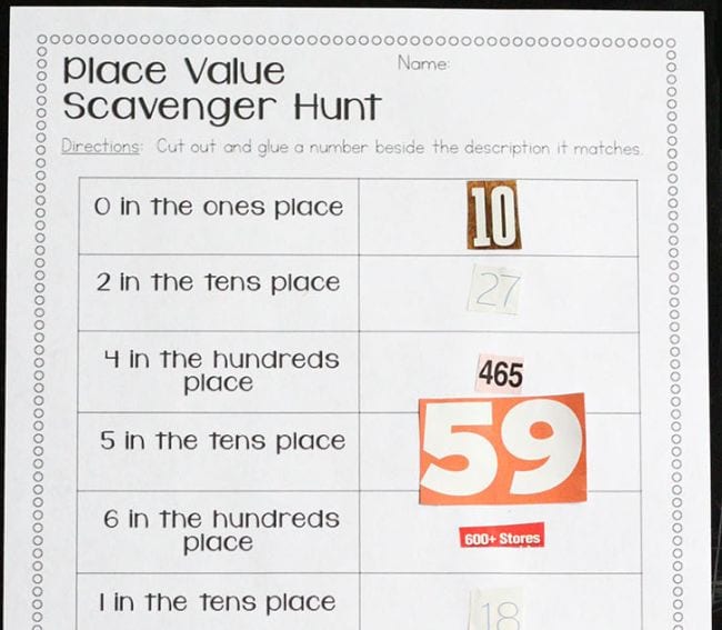 Worksheet labeled Place Value Scavenger Hunt, with numbers cut from magazines and pasted into place, part of a collection of second grade math games