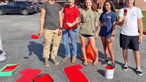Students painting the concrete